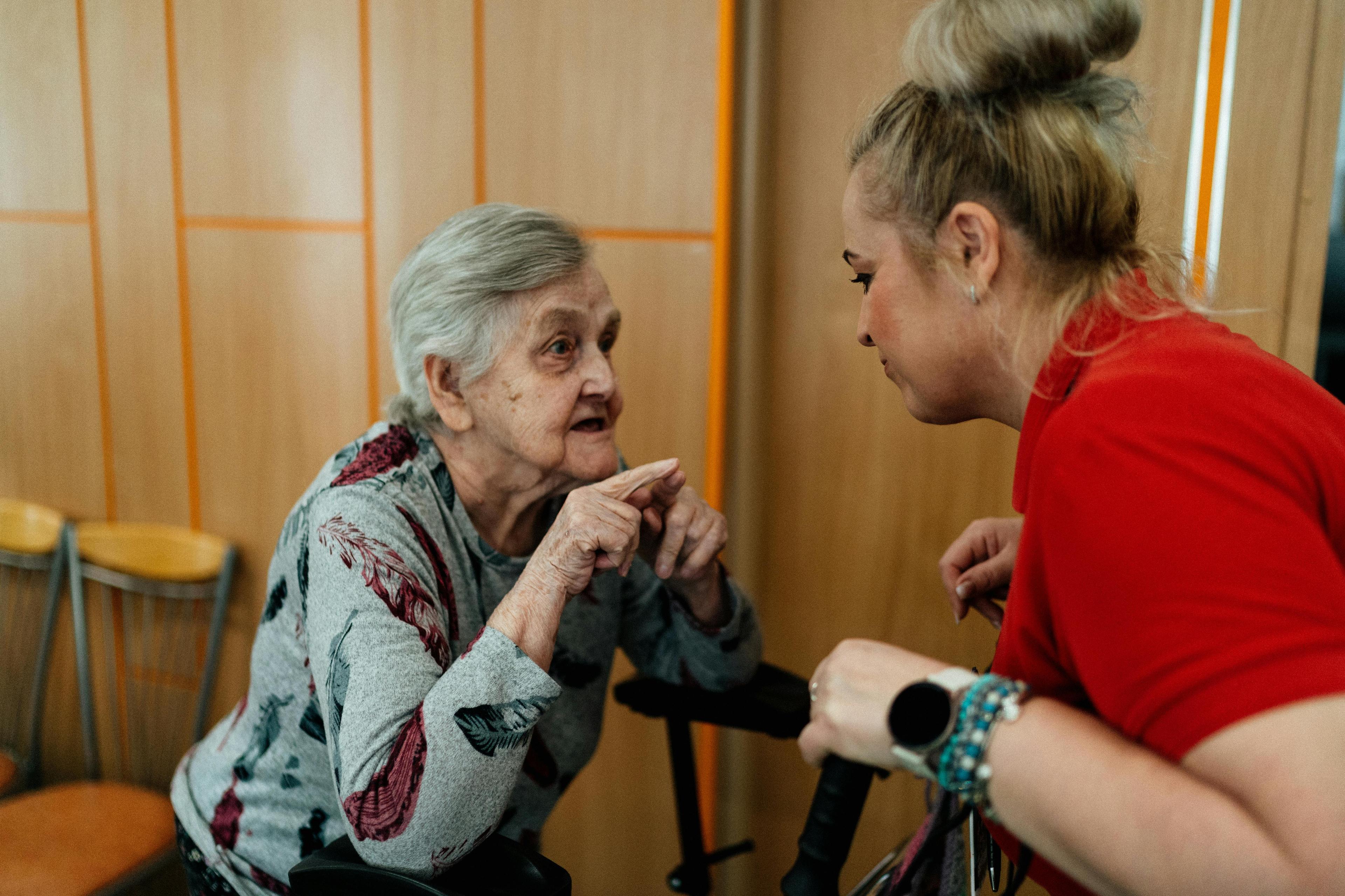 Caregiver having a heartfelt conversation with senior